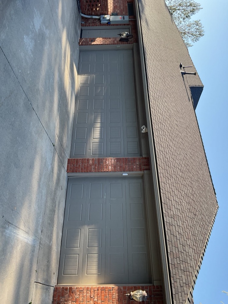 Installed gray garage doors on home exterior