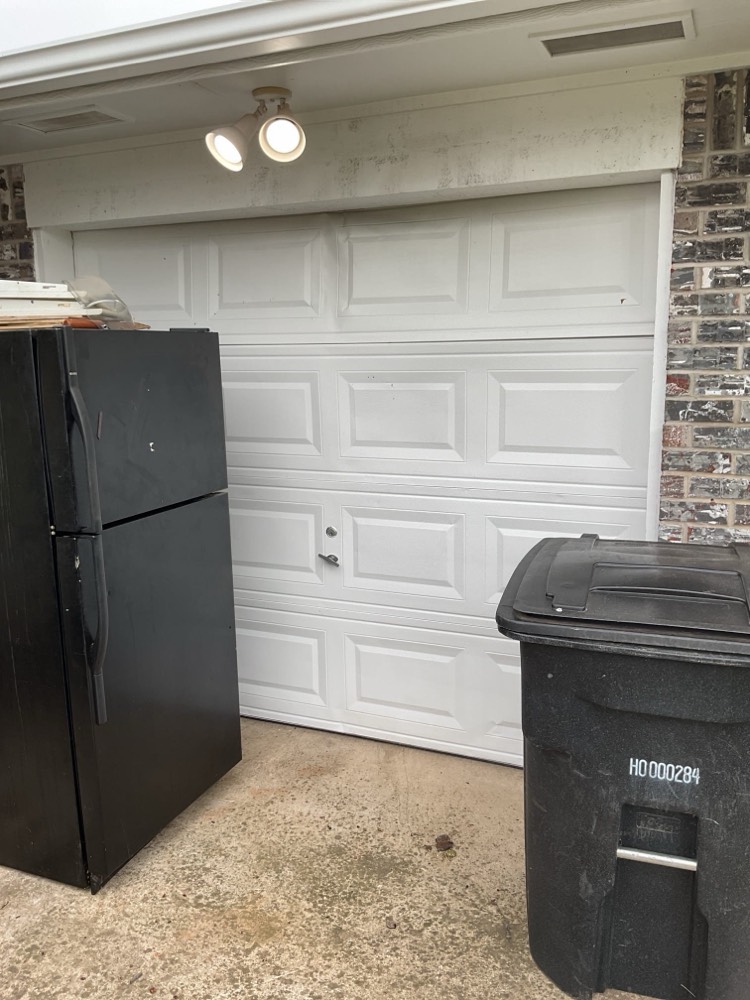 Finished white garage door installation in Moore