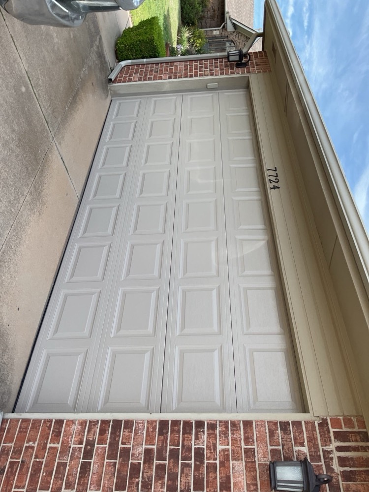 White raised-panel garage door installed on a residential home in Oklahoma City