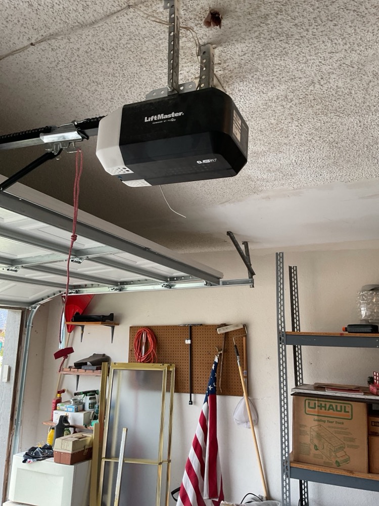 Installed LiftMaster garage door opener mounted on ceiling