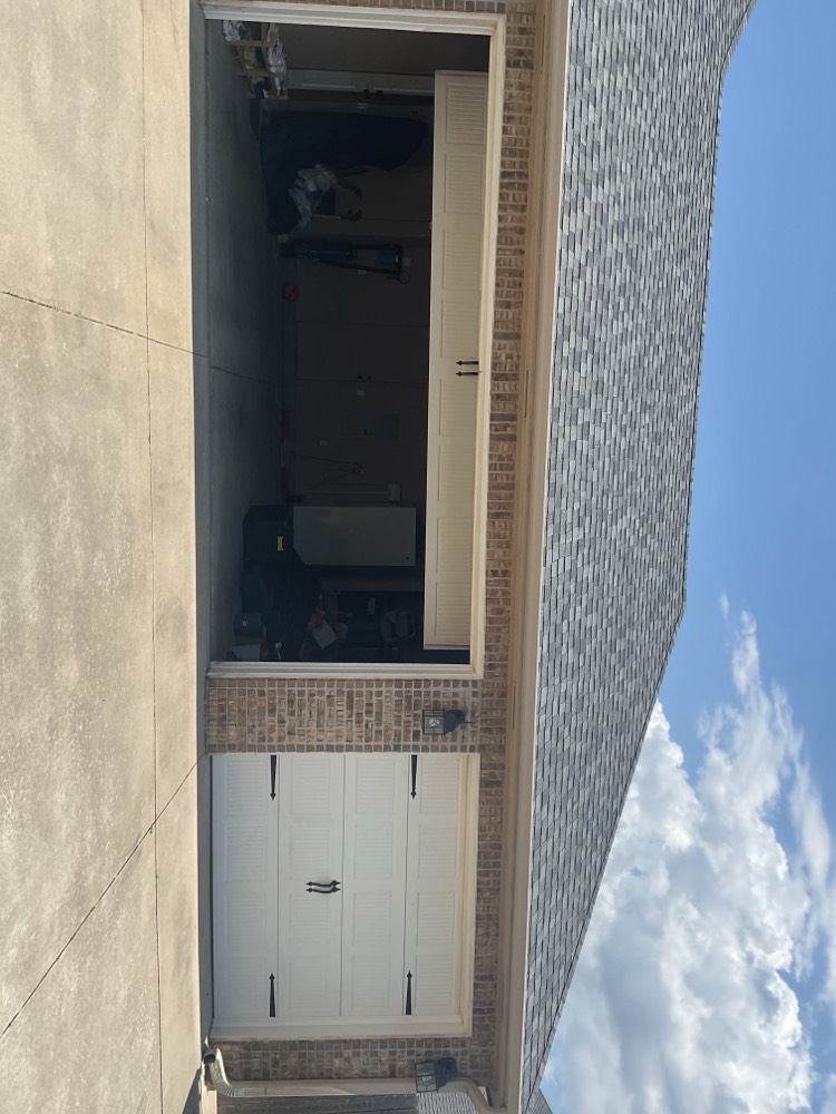 White garage door installation complete on residential home.