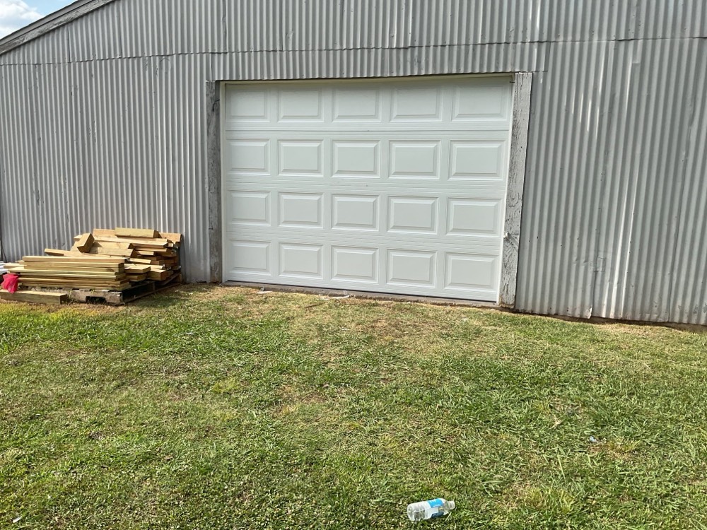 White garage door installed on metal building in Spencer