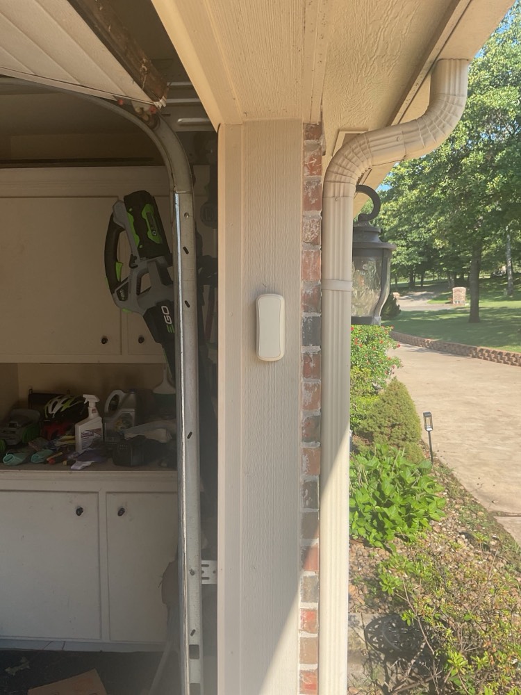 Newly installed garage door opener visible from interior showing clean, finished installation.