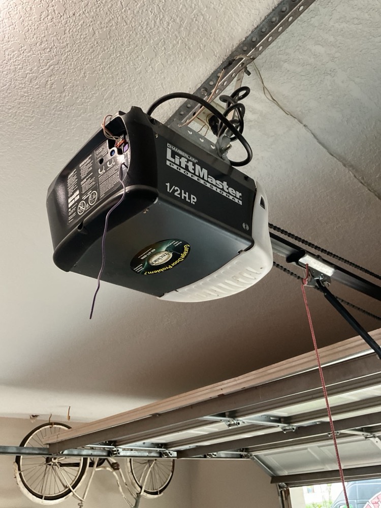 Installed LiftMaster 1/2 HP garage door opener on ceiling