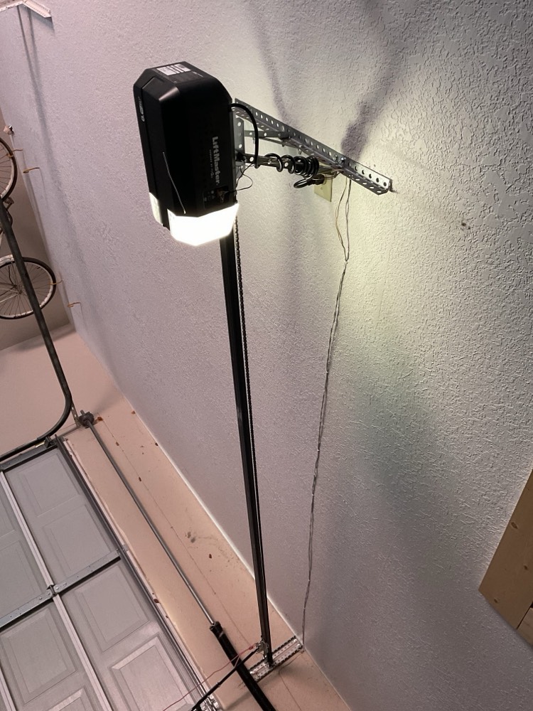 LiftMaster garage door opener motor mounted on garage wall