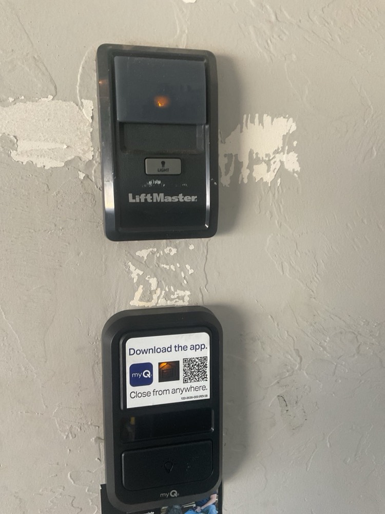 LiftMaster garage door opener control with smart app feature on wall