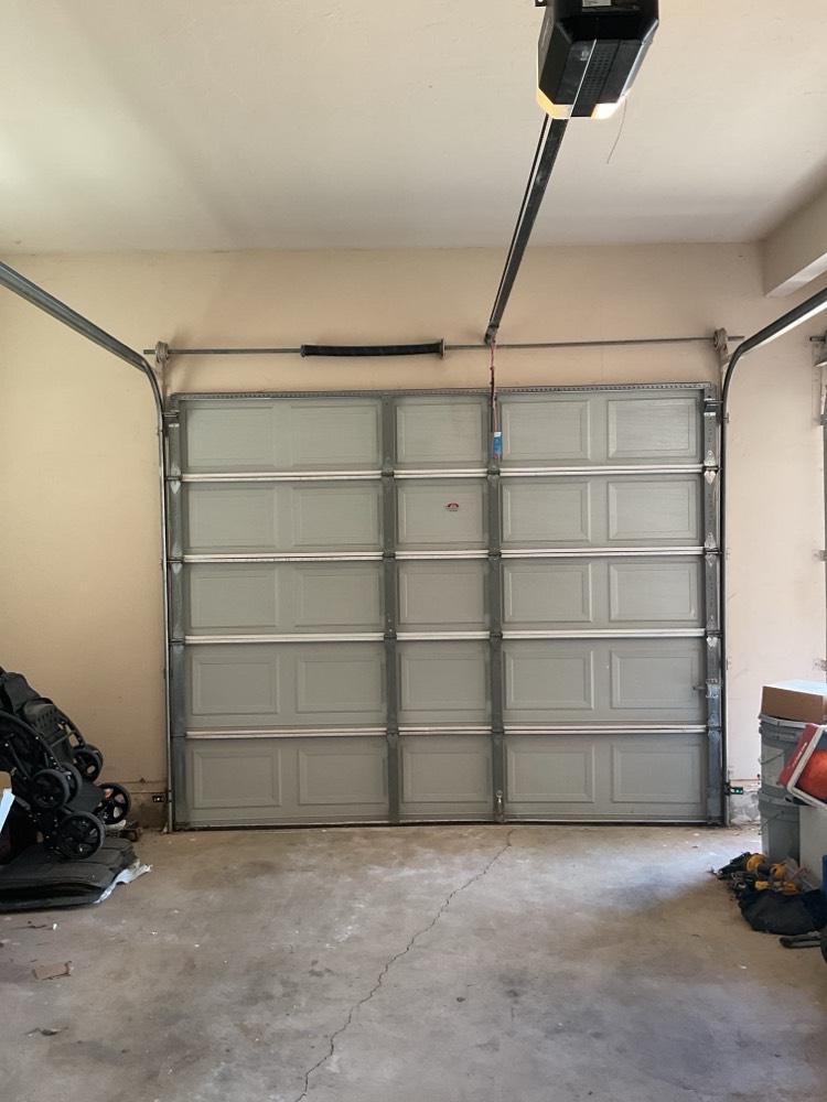 Installed garage door with new frosted glass panels and opener
