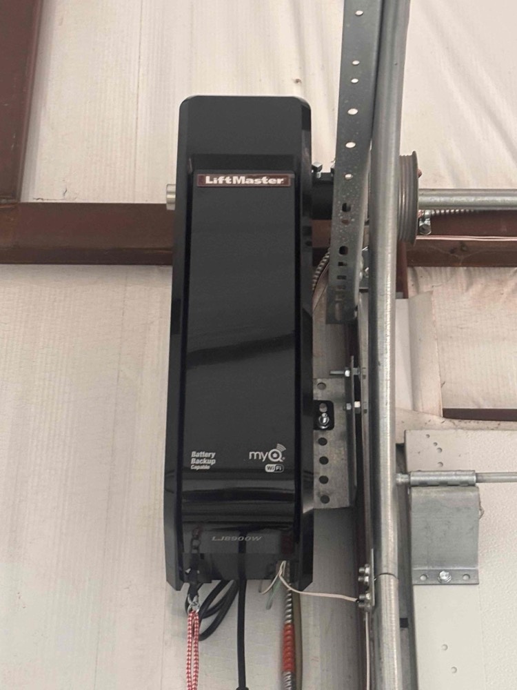 LiftMaster opener unit installed on garage door jamb