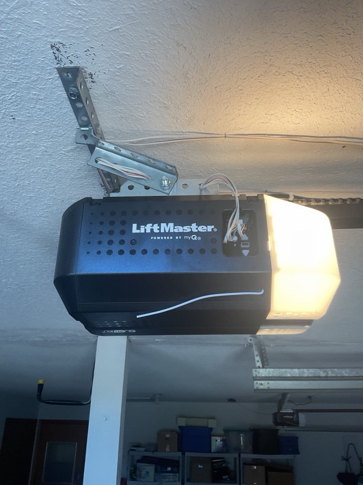 LiftMaster garage door opener mounted on garage ceiling with light