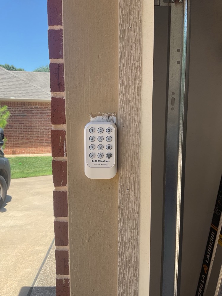 LiftMaster wireless keypad mounted on exterior garage wall