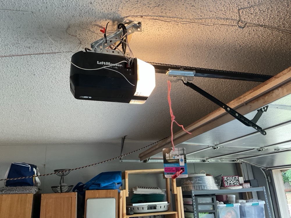 LiftMaster garage door opener motor mounted to garage ceiling