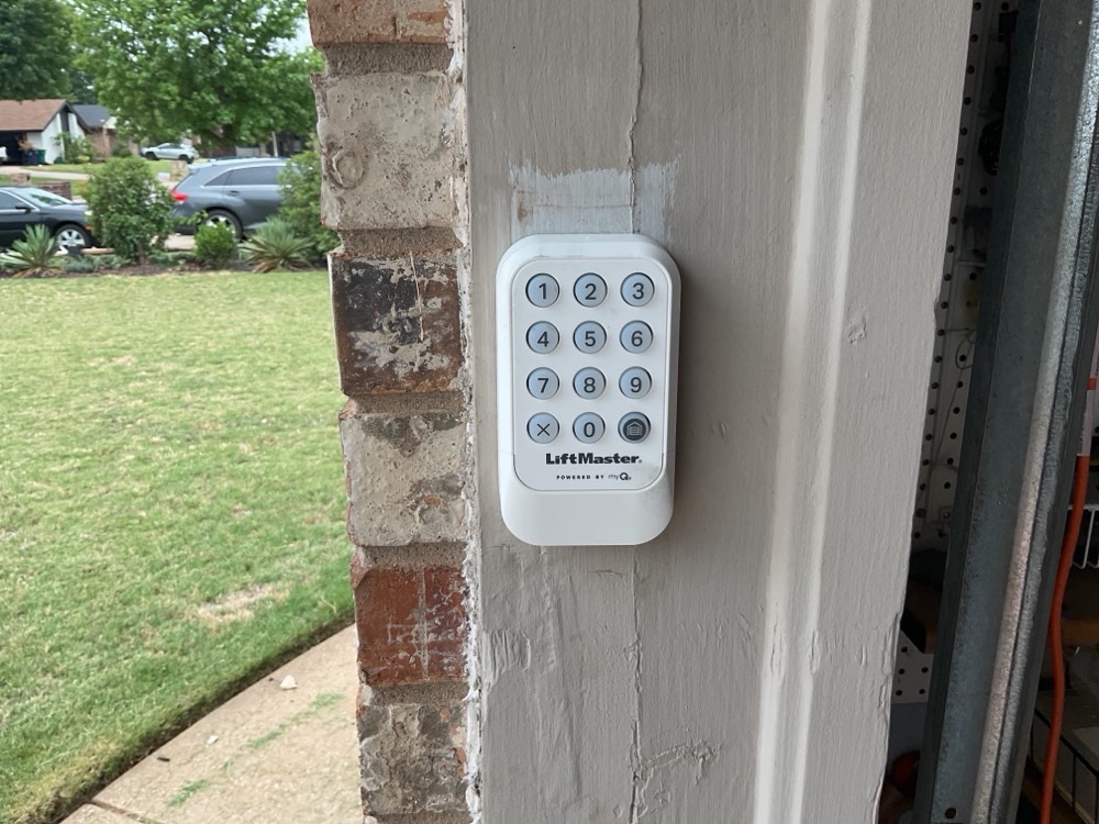 LiftMaster keypad mounted on garage exterior wall