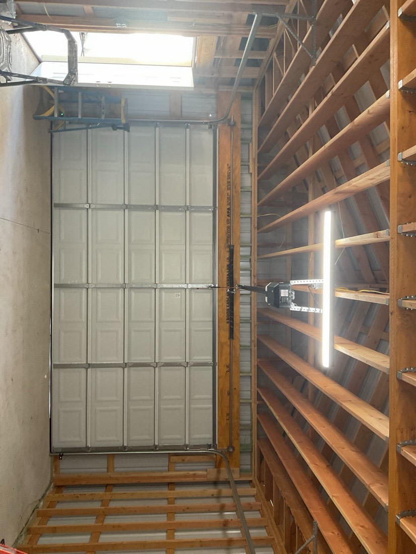New white paneled garage door installed in garage opening