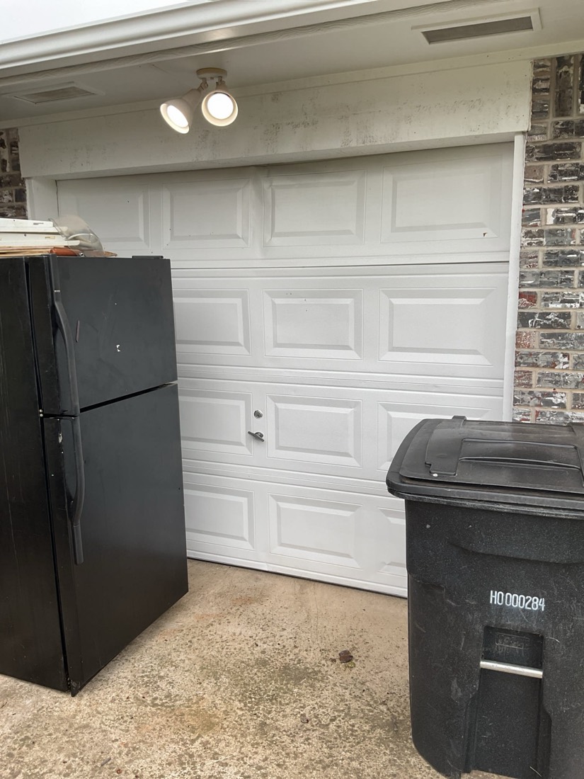 Finished white garage door installation in Moore