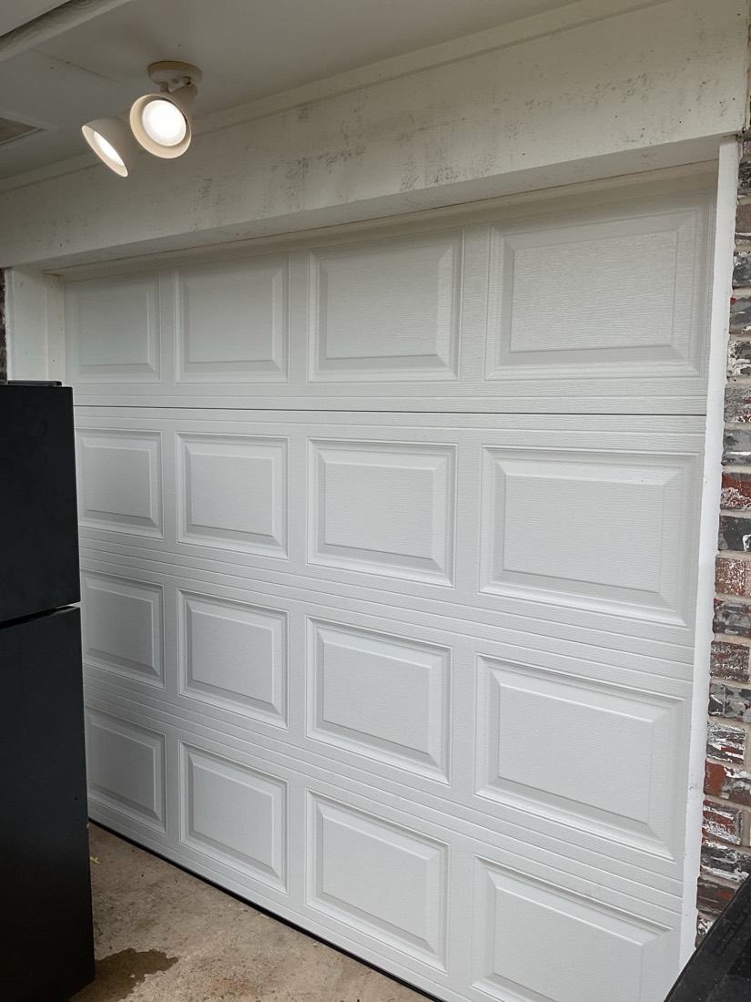 Newly installed white panel garage door in Moore, OK