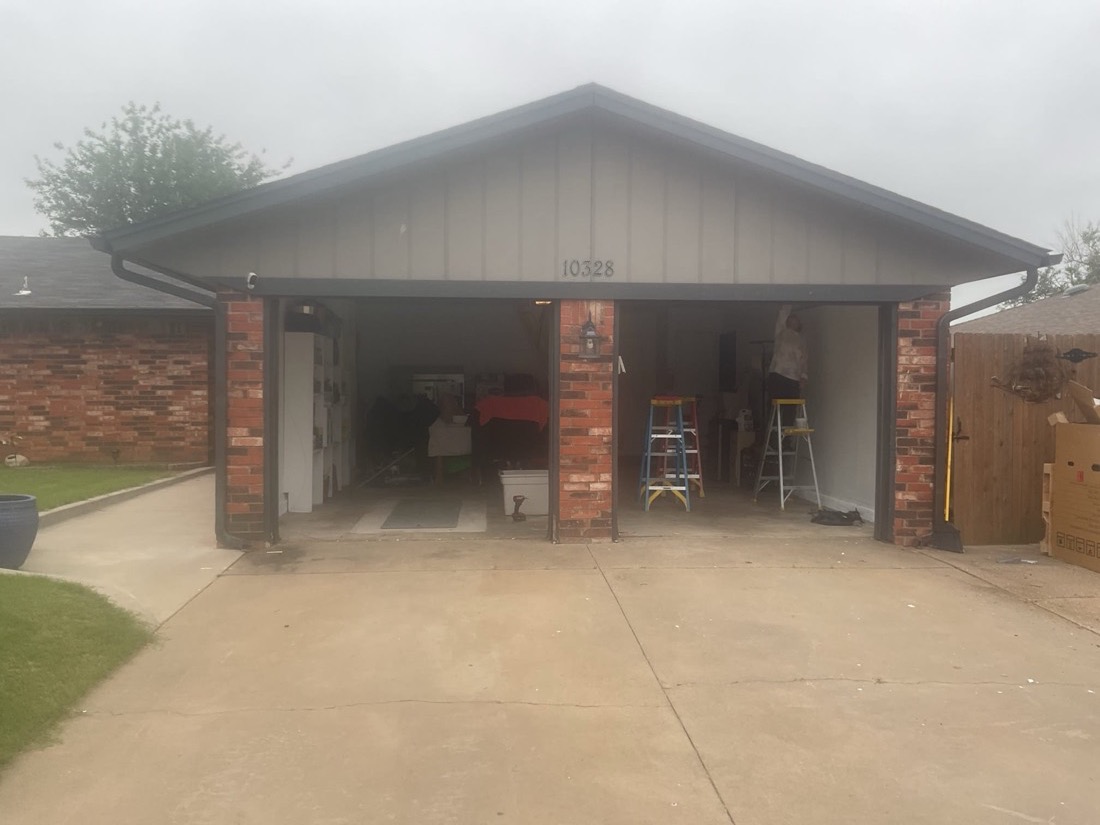 New garage door installation at brick home entrance in Yukon, OK