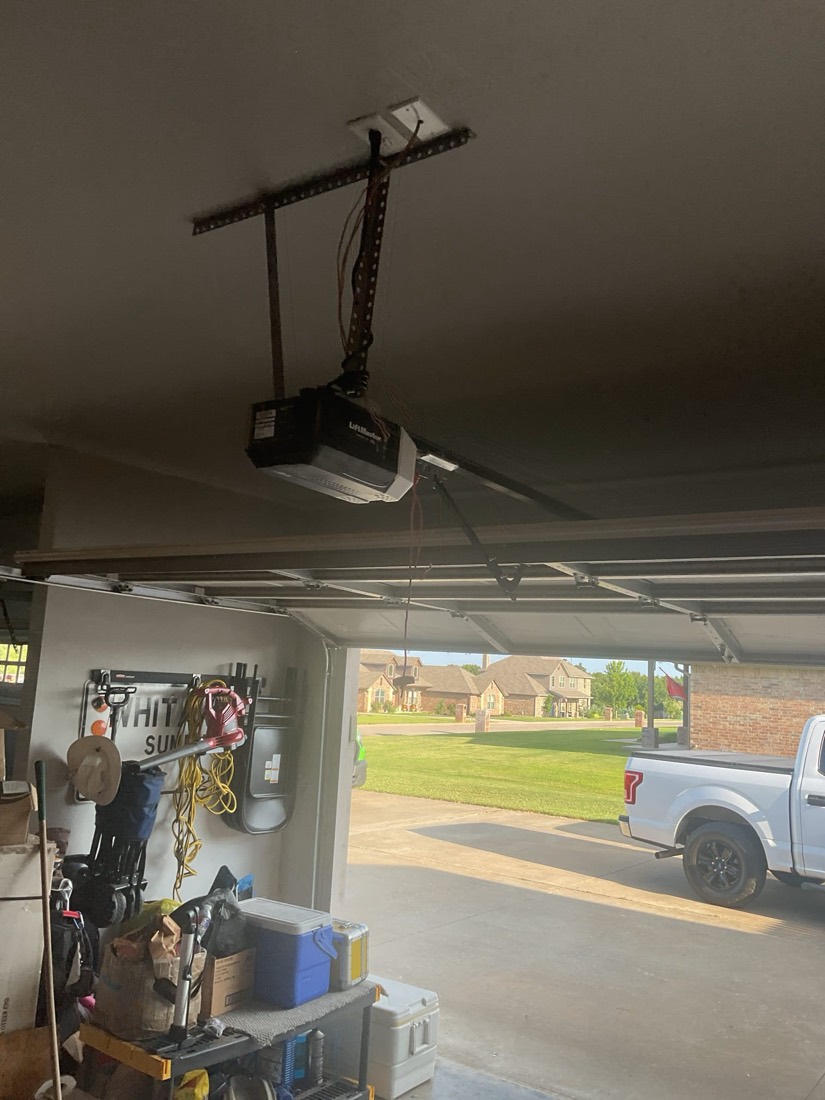 Installed LiftMaster garage door opener on ceiling with mounting bracket