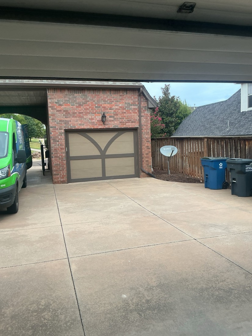 Completed garage door installation on brick residential home