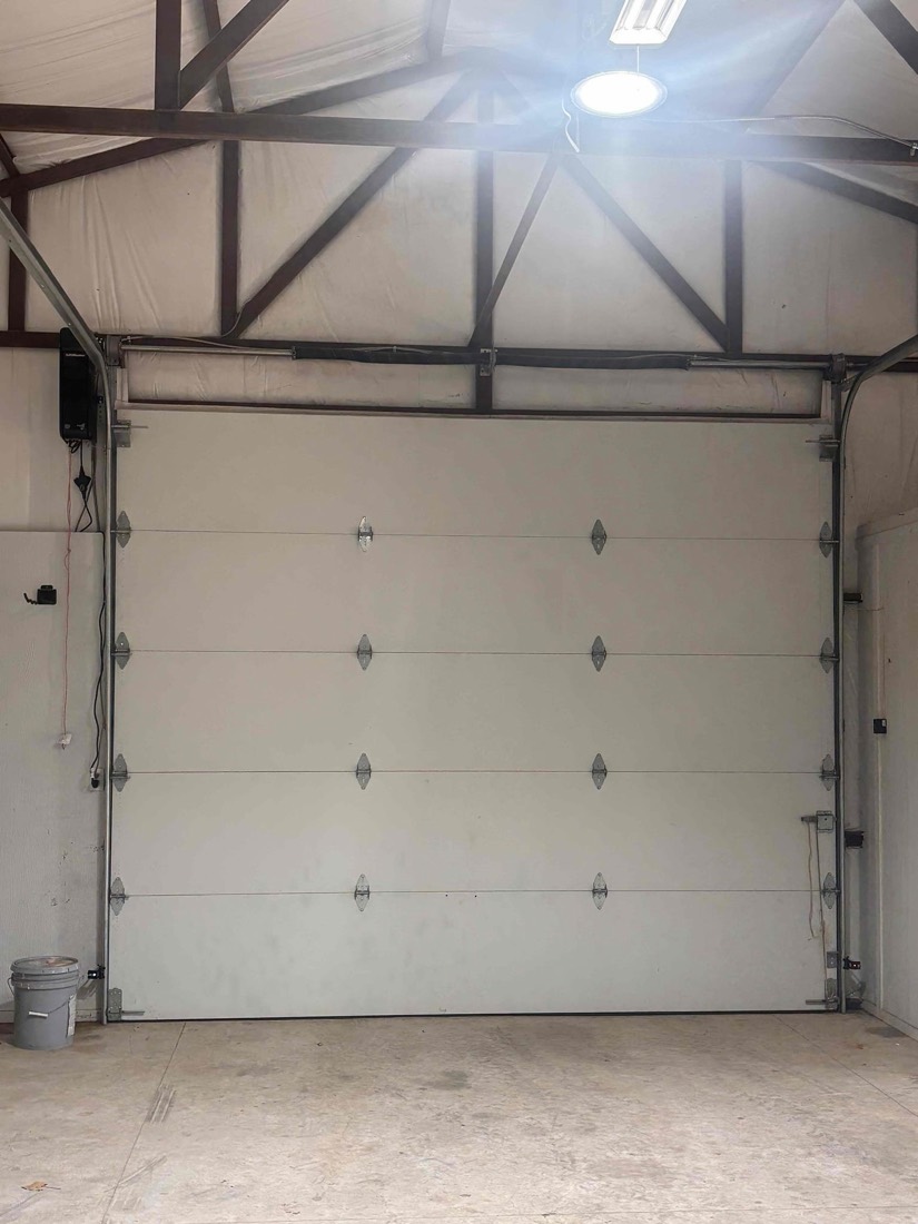 Garage door with new opener installation mounted on frame
