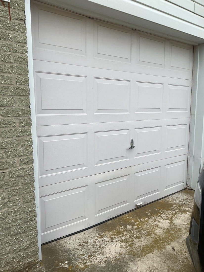 White garage door panels showing clean, professional installation.