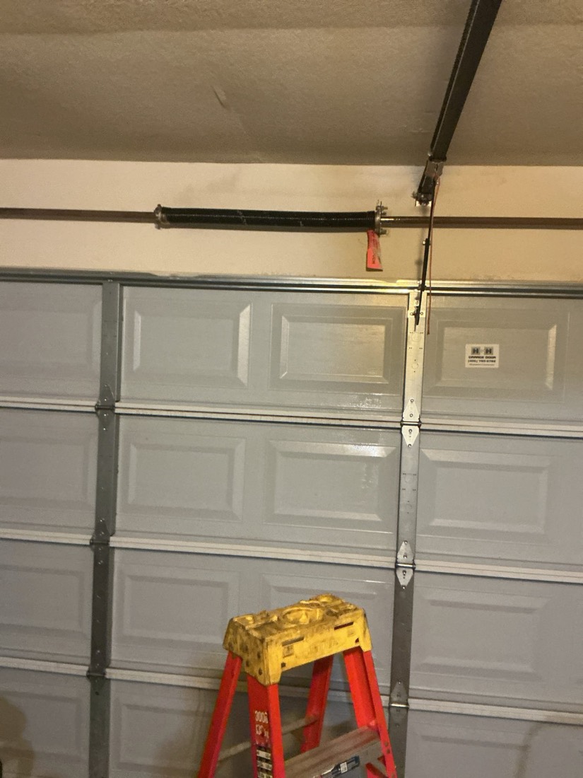 New garage door spring and cable assembly with ladder support