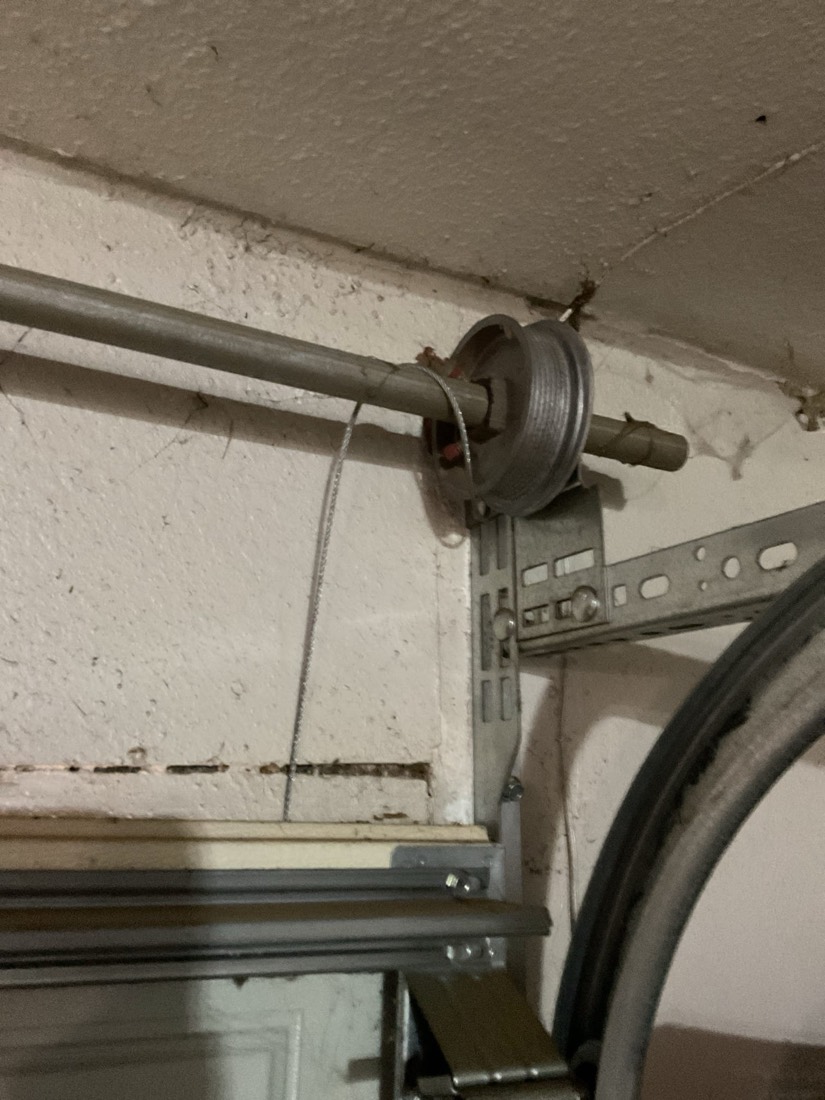 New torsion spring and cable system on garage door
