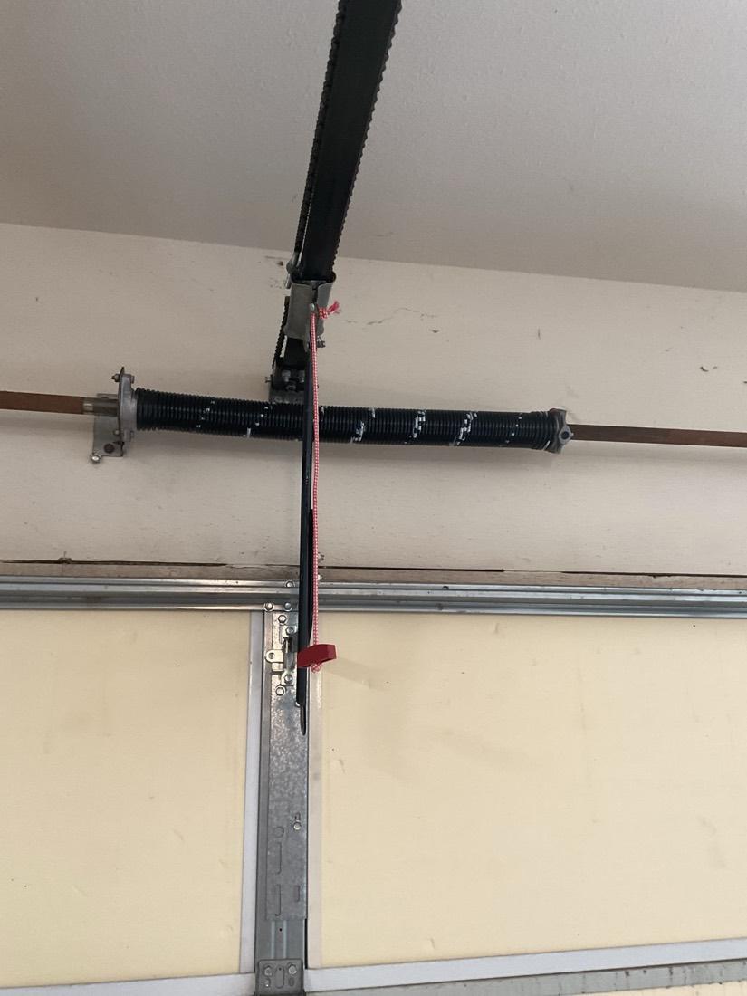 New garage door spring coil with mounting bracket