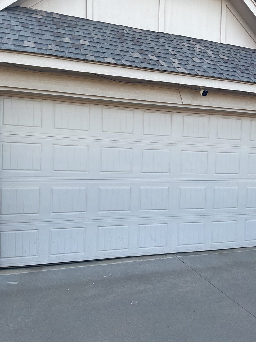 White garage door installed on residential home