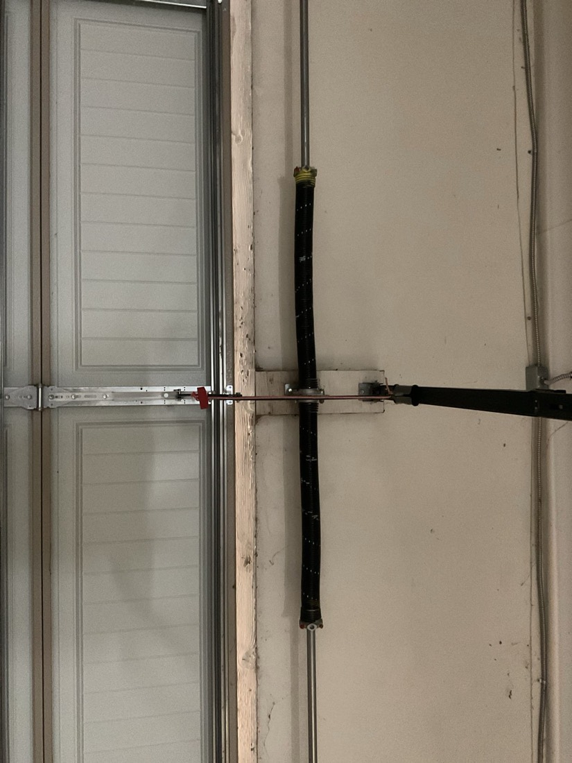 Garage door spring mechanism installed during spring repair service